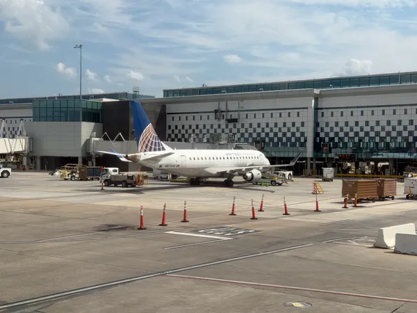 United Express flight returning to Houston after smoking battery prompts emergency declaration and FAA investigation